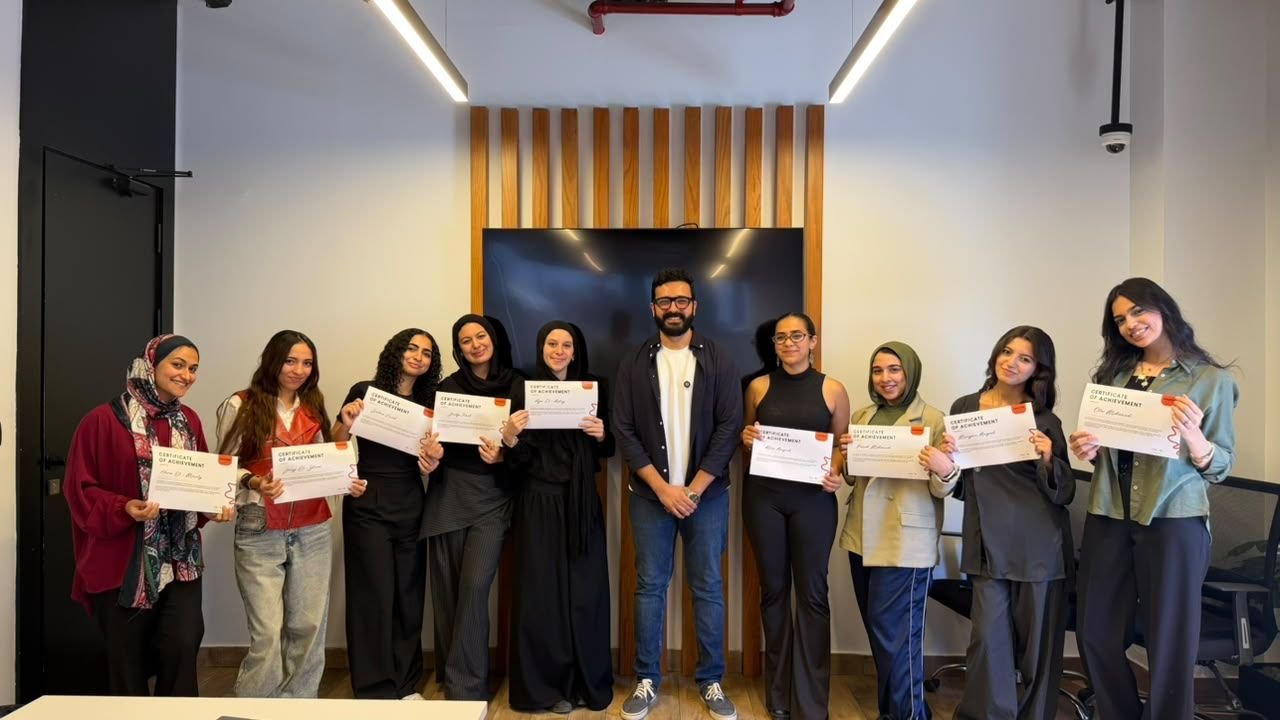 You Got Hired participants holding their certificates with Eslam